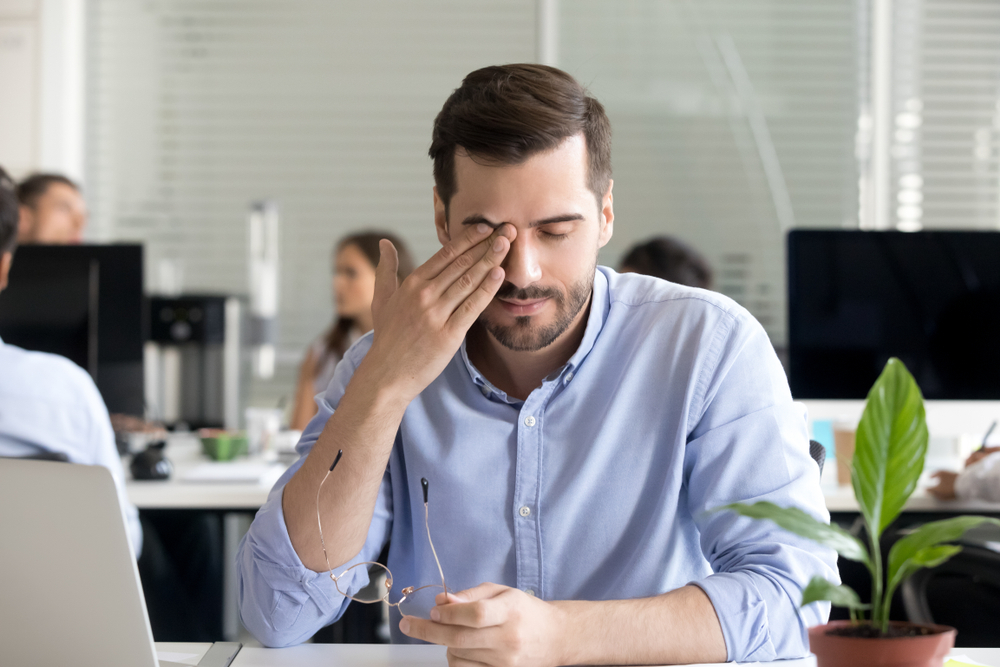 Photokeratitis eye irritation treatment at Optical Solutions Man experiencing eye discomfort associated with photokeratitis at work in Hilton Head Island and Bluffton, SC